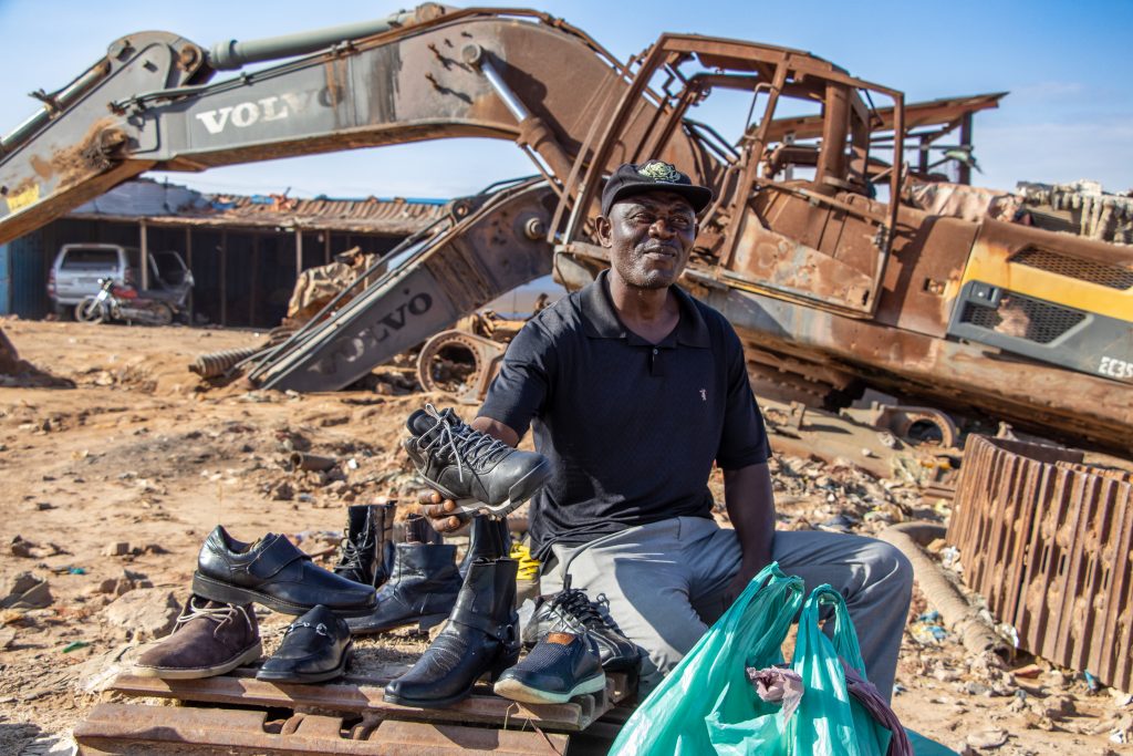 Mining worker demonstrating techniques